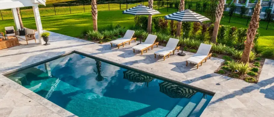 Stone pool deck surrounding a rectangular pool
